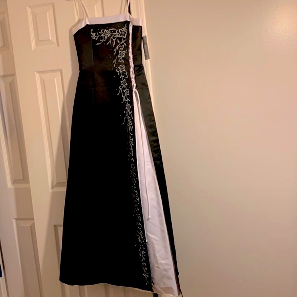 Beautiful Kiki black/white gown adorned with a floral beaded design!